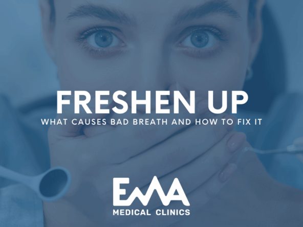 Worried woman covering her mouth with both hands during a dental visit, representing concern about bad breath, with the text "Freshen Up: What Causes Bad Breath and How to Fix It" and EMA Medical Clinics logo.